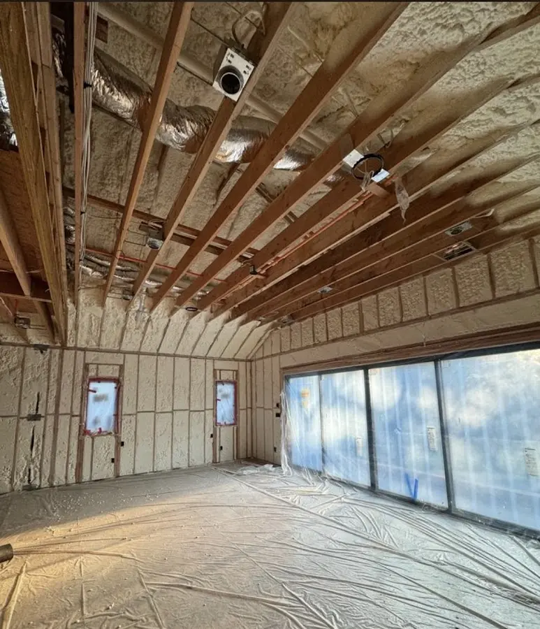 Interior walls and ceiling insulated with spray foam during new construction in Mayfair